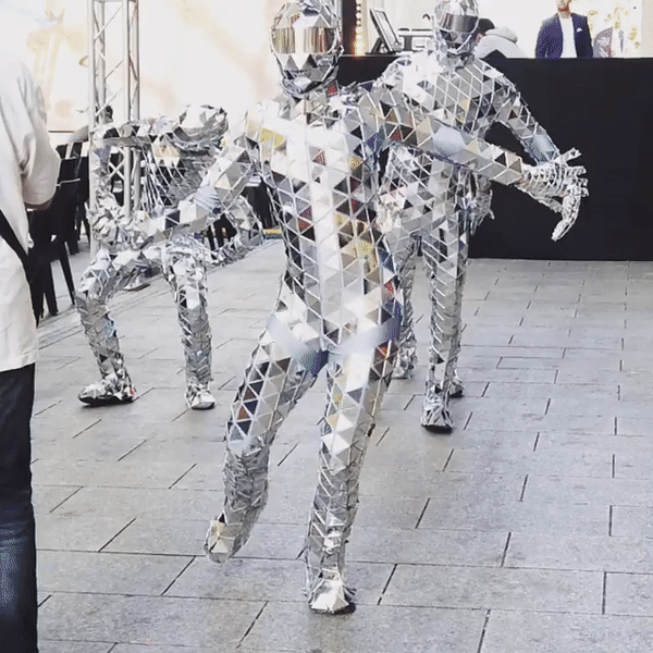 Flexibe mirror costume glowing in slow motion