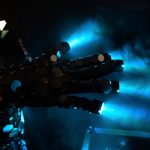 Warn blue light glows from mirrored glove