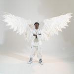 Large white mechanical wings with LEDs